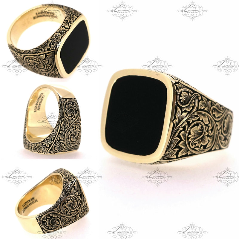 Yellow gold cushion signet ring set with onyx.  Hand engraved leafy scroll patternwork on shoulders