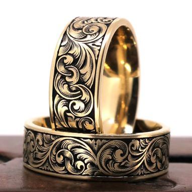 Scrollwork on matching wedding bands