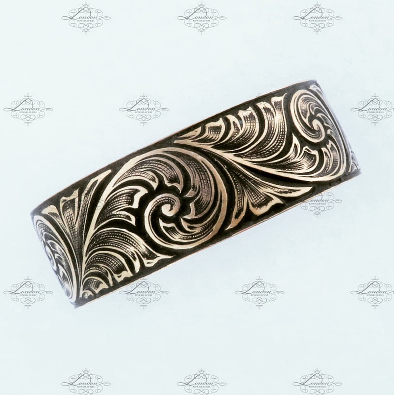 8mm wide yellow gold mens wedding ring with hand engraved scrollwork and black enamel