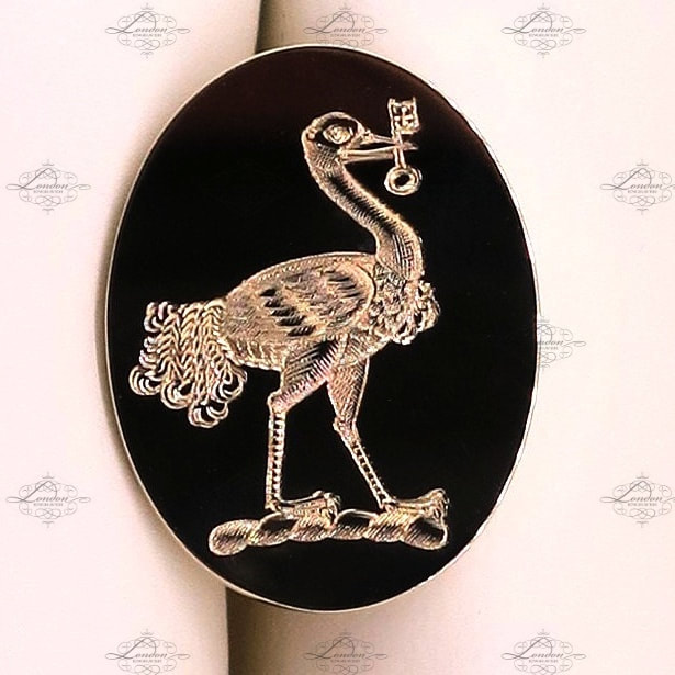 Emu or ostrich family crest surface engraved on yellow gold cufflinks