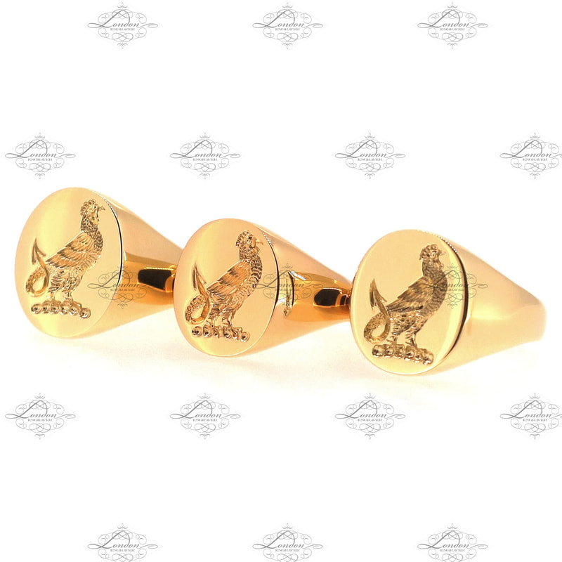 Three yellow gold signet rings with matching seal engraved crests