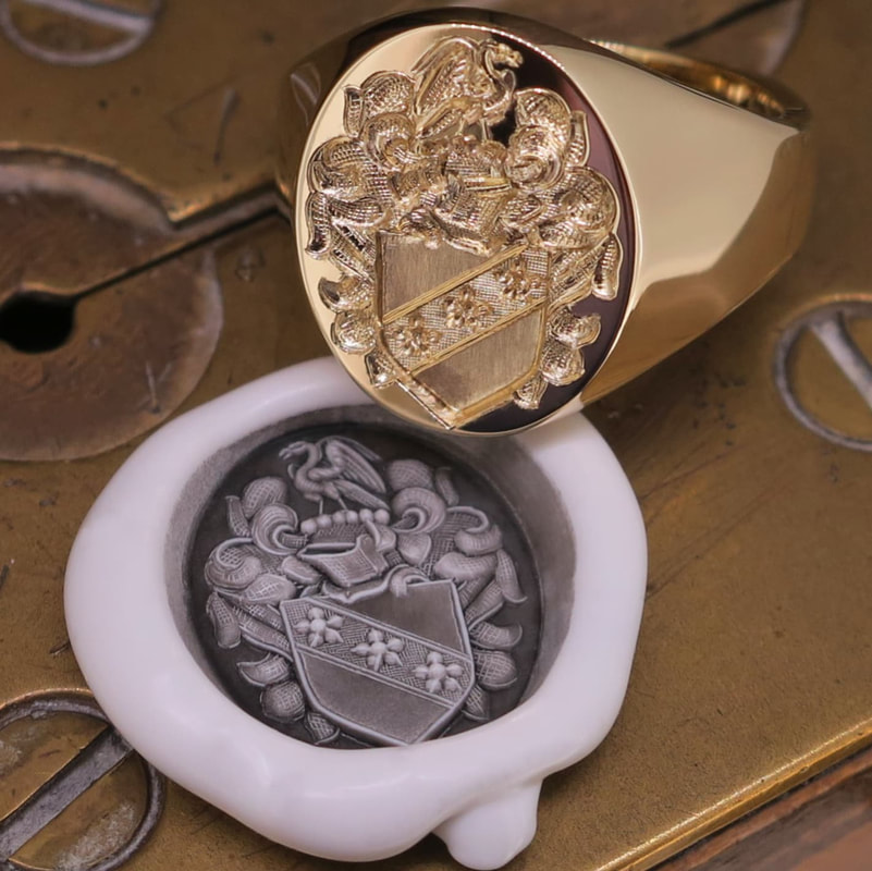 Seal Engraved Carey Coat of Arms on a yellow gold signet ring, with wax impression
