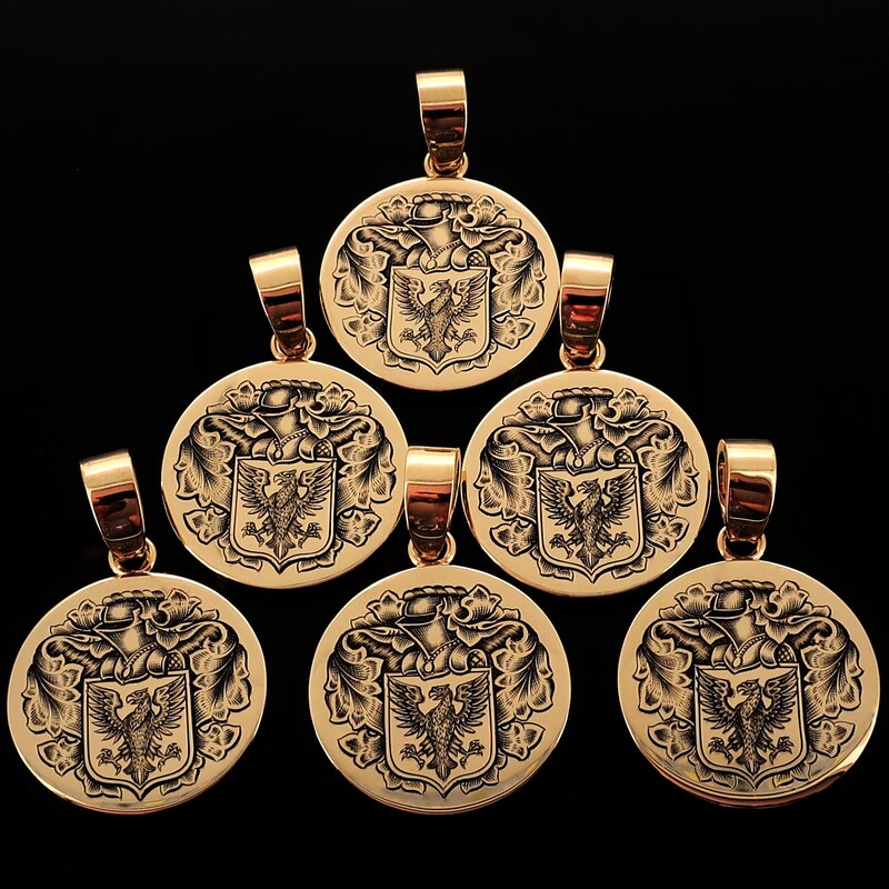 Six matching yellow gold pendants, round, hand engraved with a Coat of Arms